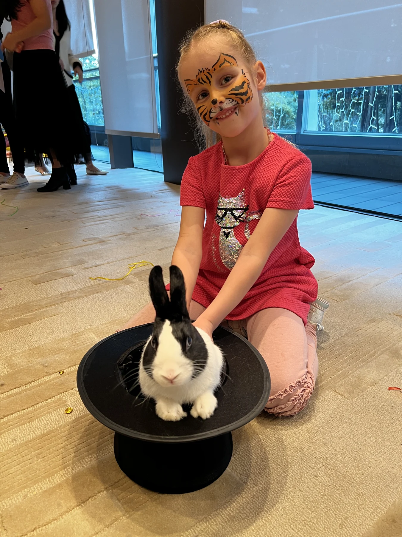 Child with face paint meeting a Magical Guy rabbit