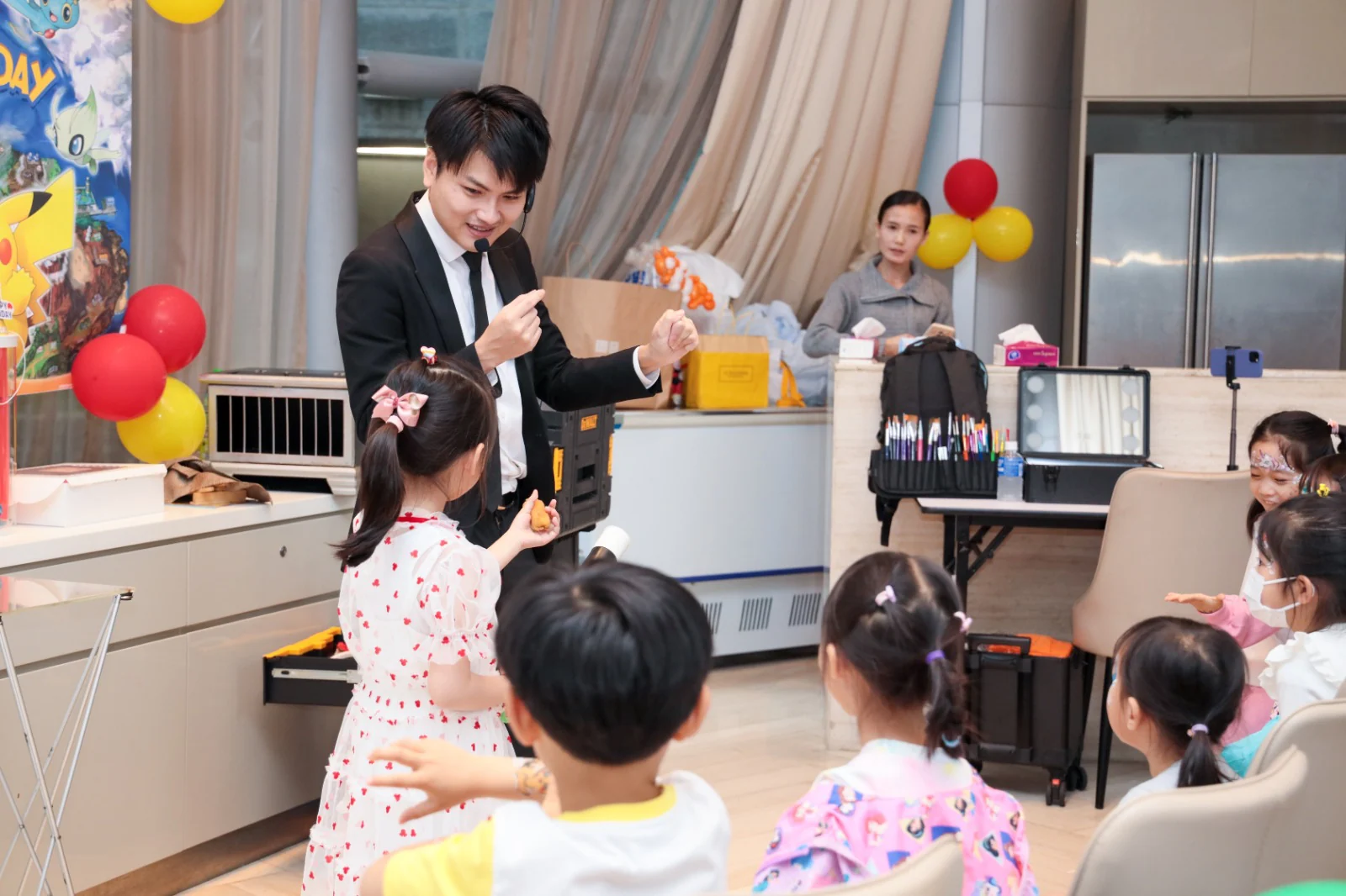 Magical Guy performing for children at a party