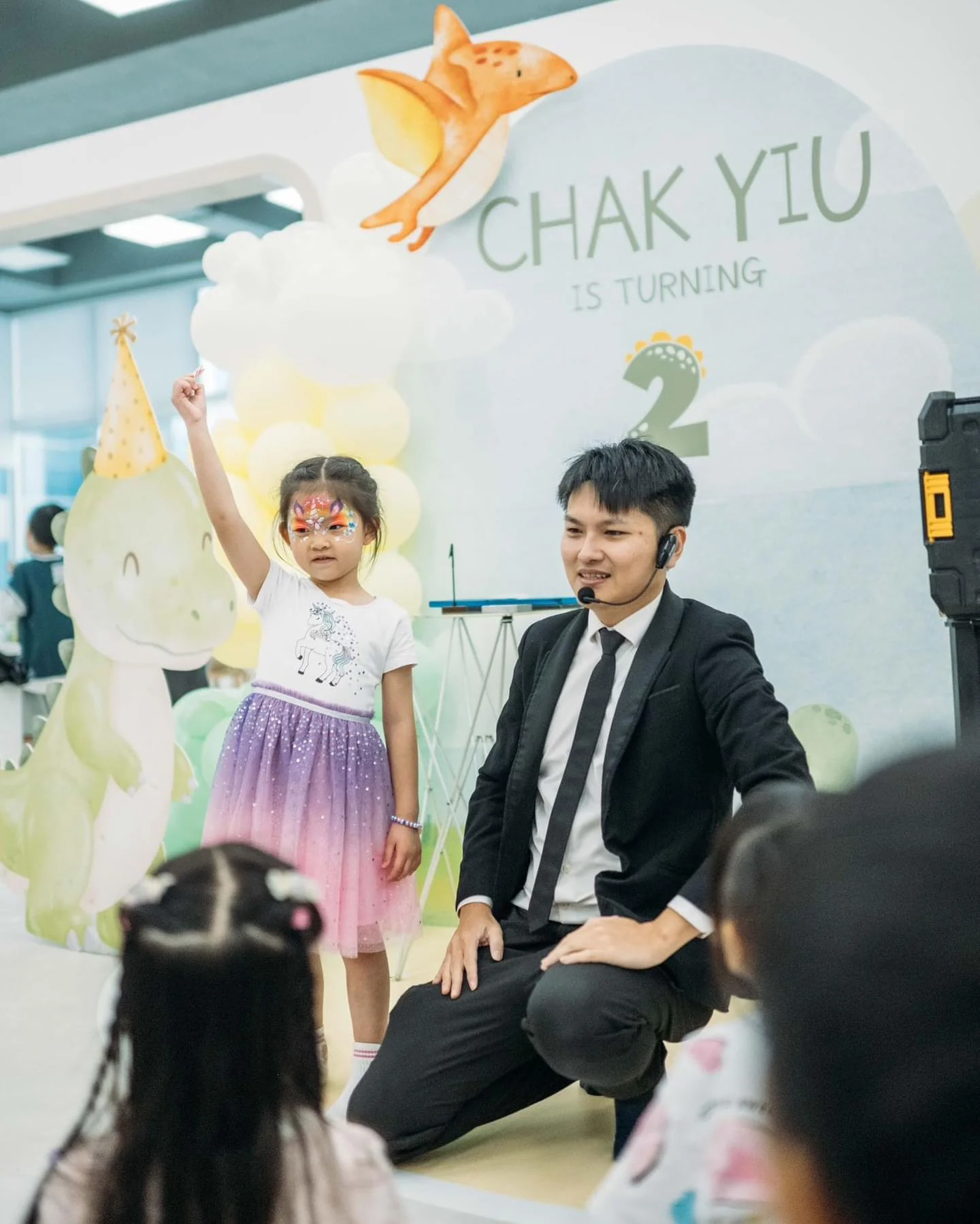 Magical Guy performing with children on stage