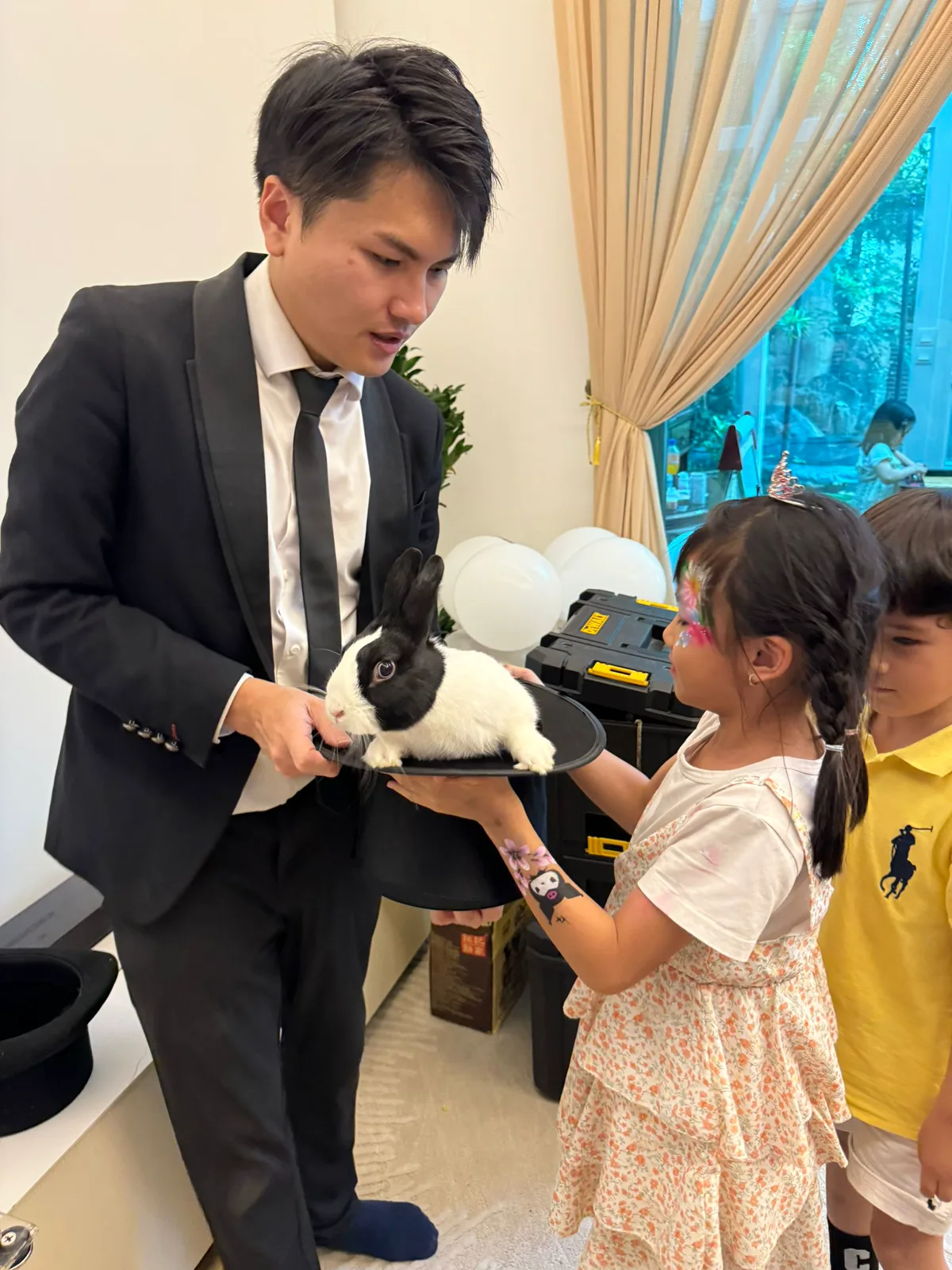 Magical Guy live magic moment with rabbit and children