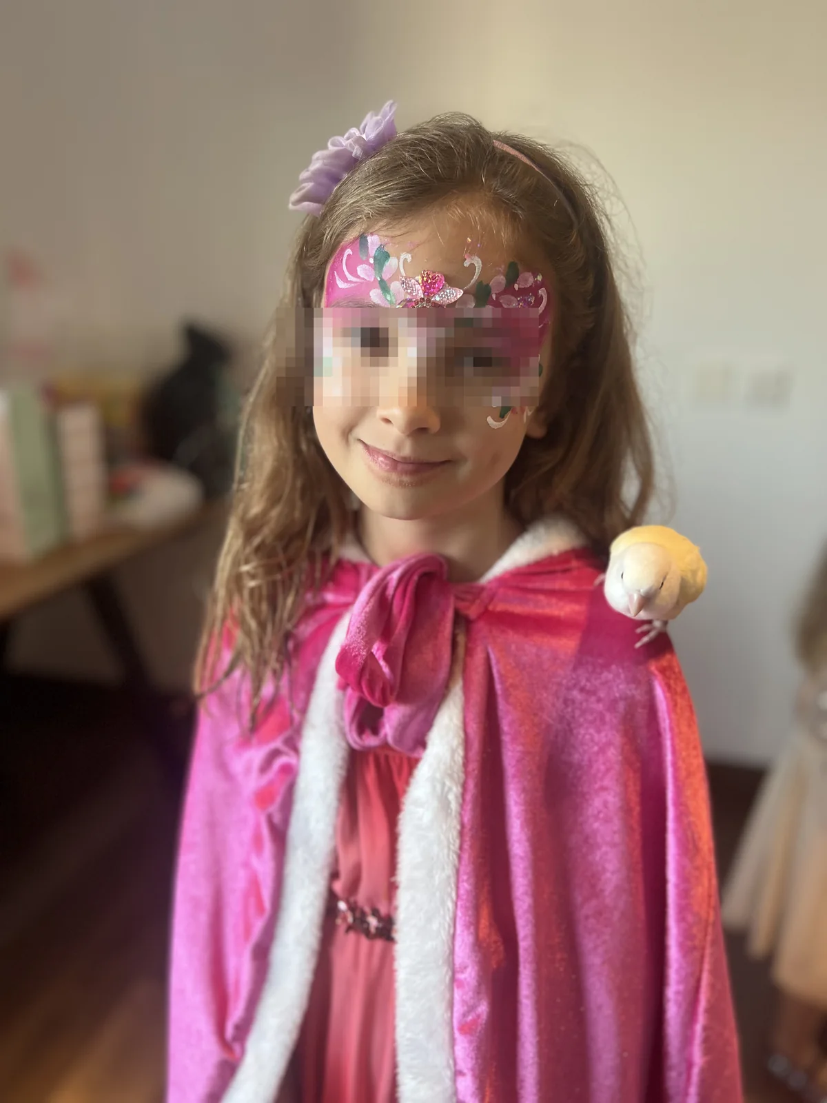 Privacy-safe birthday child with a Magical Guy parrot on the shoulder